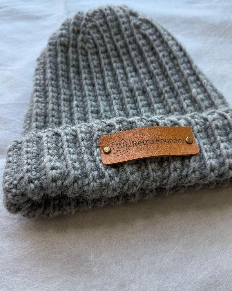 Handmade beanie with a leather patch labeled 'Retro Foundry', Gray